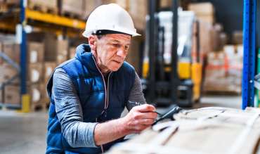 portrait-of-a-senior-male-warehouse-worker-or-a-su-F59H23T.jpg